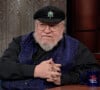 George R.R. Martin sur le plateau de l'émission "The Late Show With Stephen Colbert" à New York. © JLPPA/Bestimage  Game of Thrones and House of the Dragon author George RR Martin wishes he could send dragons to the Kremlin should Russian leader Vladimir Putin ever use nuclear bombs.The 74-year-old fantasy writer made the comments at the end of a rare TV appearance.He appeared on the Stephen Colbert US talk show to discuss his new illustrated history of the Targaryen dynasty as featured in HBO’s House of the Dragon TV series.The House of the Dragon drama is set 200 years before the events of Games of Thrones and focuses on the civil war between Targaryen family factions.It is an abbreviated version of the original 300,000 word book Fire and Blood and features 150 original illustrations by artists from all over the world bringing the fantasy worlds of Westeros and beyond to life.One of the images Colbert focussed on was the Iron Throne , made from the weapons of defeated enemies.While the TV series shows it as a single seat, the illustration reveals it sitting at the top of a stairway flanked by many more captured arms.Colbert said:” I was not aware of this.“We all have an image in our head of the Iron Throne from the series on HBO Game of Thrones.Martin replied:” That is what it is supposed to look like.“A lot of the kings cut themselves on It and sometimes get infected so it is probably good that you don't have an iron seat here ! 