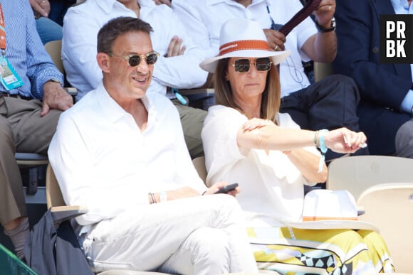 Julien Courbet et sa femme Catherine en tribunes lors des Internationaux de France de tennis de Roland Garros 2023, à Paris, France, le 6 juin 2023. © Jacovides-Moreau/Bestimage 