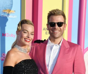 LOS ANGELES, CA - JULY 9: Margot Robbie and Scott Evans at the world premiere of Barbie at Shrine Auditorium in Los Angeles, California on July 9, 2023.
