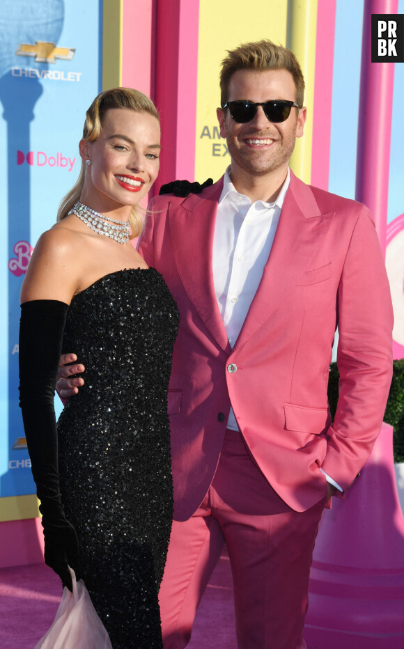 LOS ANGELES, CA - JULY 9: Margot Robbie and Scott Evans at the world premiere of Barbie at Shrine Auditorium in Los Angeles, California on July 9, 2023.