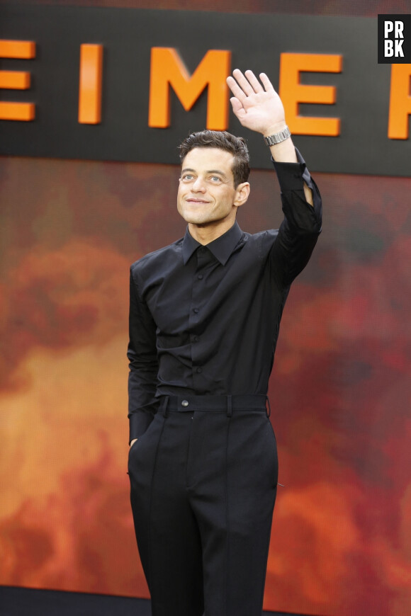 BGUK_2685708 - London, UNITED KINGDOM - Cast and guests walk along the 'charred' black carpet at the Oppenheimer Premiere in London. Pictured: Rami Malek
