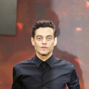 BGUK_2685708 - London, UNITED KINGDOM - Cast and guests walk along the 'charred' black carpet at the Oppenheimer Premiere in London. Pictured: Rami Malek