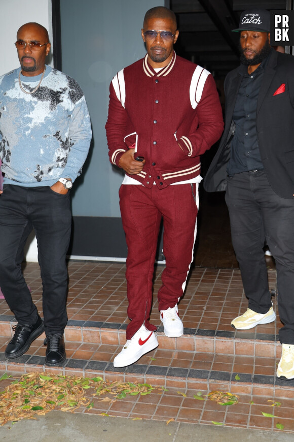 West Hollywood, CA - Jamie Foxx was spotted leaving the popular celebrity restaurant Catch Steak in West Hollywood after dinner with a friend, looking really good in a red outfit. Pictured: Jamie Foxx