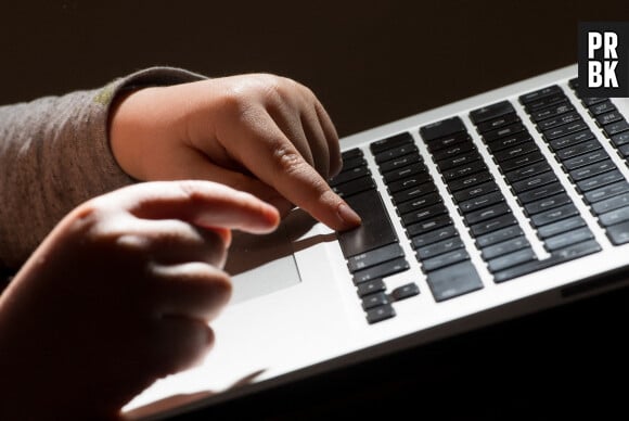 File photo dated 26/05/22 of a child using a laptop computer. Child protection experts have fiercely criticised social media giant Meta Photo credit should read: Dominic Lipinski/PA Wire