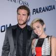 Miley Cyrus et Liam Hemsworth encore "heureux" sur le tapis rouge de Paranoia, en août 2013