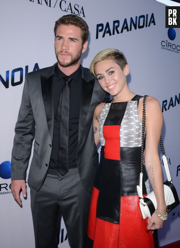 Miley Cyrus et Liam Hemsworth encore "heureux" sur le tapis rouge de Paranoia, en août 2013