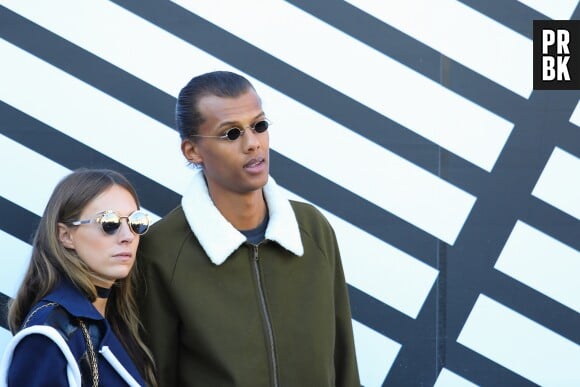 Stromae et sa femme Coralie au défilé Louis Vuitton.