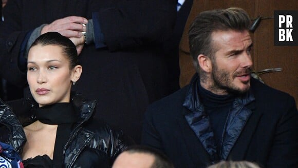 David Beckham et Bella Hadid très proches et complices dans les gradins du match PSG-Real Madrid.