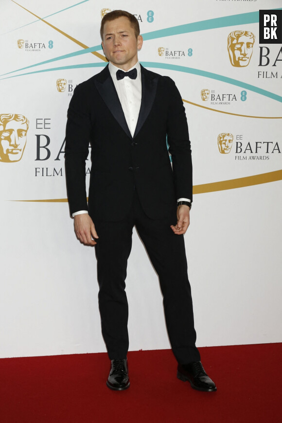Taron Egerton au photocall de la 76ème cérémonie des British Academy Film Awards (BAFTA) au Royal Albert Hall à Londres, le 19 février 2023.