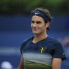 Roger Federer souriant pendant son entraînement à l'US Open 2013