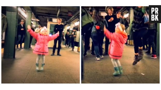 Une petite fille danse dans le métro.