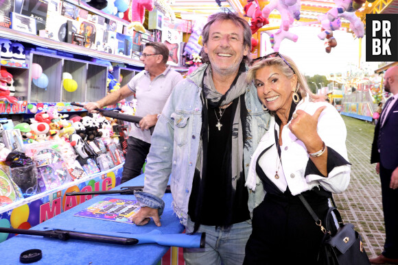 Semi-exclusif - Jean-Luc Reichmann et Caroline Margeridon lors de l'ouverture de la Fête à Neuneu 2023 © Cédric Perrin/Bestimage