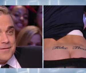 Le Grand Journal : Antoine de Caunes montre ses fesses tatouées à Robbie Williams