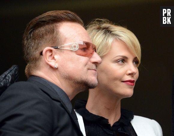 Bono et Charlize Theron à la cérémonie d'hommage à Nelson Mandela, le 10 décembre 2013 à Soweto