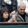 Raymond Domenech et Estelle Denis dans les tribunes de Roland Garros le 27 mai 2014