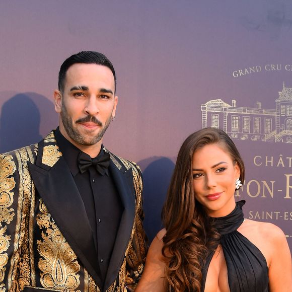 Adil Rami et sa compagne Léna Guillou - 9ème gala étoilé Patrick Mouratoglou (coach légendaire de S. Williams) au profit de la Fondation Champ'seed à la Mouratoglou Academy afin de soutenir les jeunes espoirs du tennis mondial à Biot le 18 juin 2023. Un dîner était organisé autour de l'iconique piscine en forme de raquette, suivi d'une vente aux enchères avec des lots prestigieux dont une heure d'entrainement en compagnie de M. Tyson. 