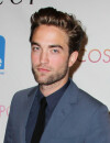 Robert Pattinson fait le beau pour protéger Kristen des flashs