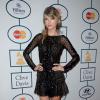 Taylor Swift et robe noire transparente lors d'une soirée pré-Grammy Awards le 25 janvier 2014