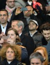 Youri Djorkaeff, Jamel Debbouze, Pierre Niney, Lilian Thuram et Louis Sarkozy dans les tribunes du Parc des Princes pour le match PSG-Chelsea, le 17 février 2015