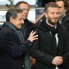Nicolas Sarkozy et David Beckham dans les tribunes du Parc des Princes pour le match PSG-Chelsea, le 17 février 2015
