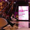 M. Pokora aime les seins et les fesses d'Amanda Lear dans une scène du 'Mépris' pour Un Soir à la Tour Eiffel, le 18 février 2015 sur France 2