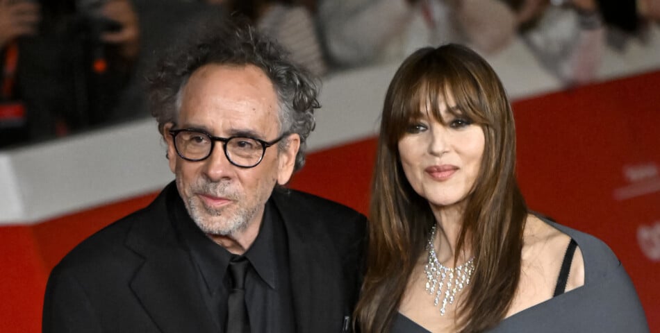Film director Tim Burton and actress Monica Bellucci attend the red ...