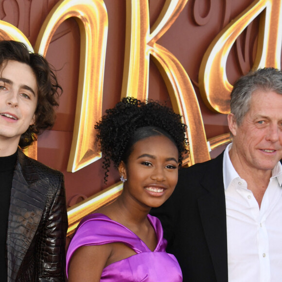 10 December 2023. LOS ANGELES, CA - DECEMBER 10: Timothée Chalamet, Calah Lane and Hugh Grant at the premiere of Wonka at the Regency Village Theater in Westwood, California on December 10, 2023.