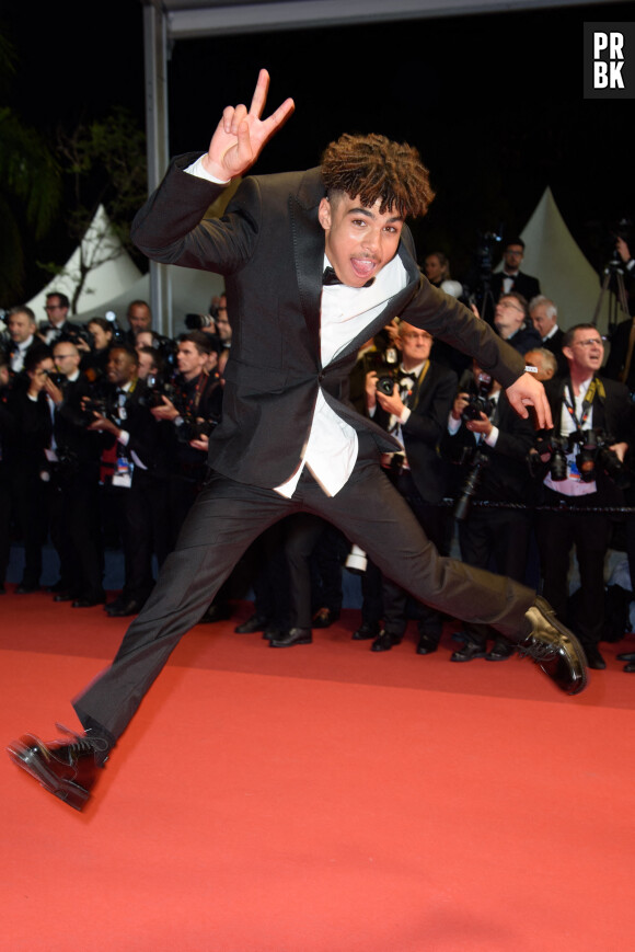 Ethann Isidore à la montée des marches de "Indiana Jones et le Cadran de la destinée" lors du 76ème Festival International du Film de Cannes, le 18 mai 2023.