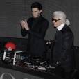  Baptiste Giabiconi et Karl Lagerfeld pour le lancement du site "Giabiconi Style" avec un gros bouton rouge 