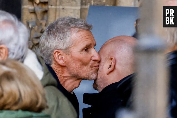 Denis Brogniart, Sébastien Cauet - Sorties des obsèques de Jean-Pierre Pernaut en la Basilique Sainte-Clotilde à Paris, France, le 9 mars 2022. © Cyril Moreau/Bestimage