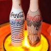 Après les bouteilles imaginées par Jean-Paul Gaulter, Coca-Cola proposera des bouteilles à votre nom