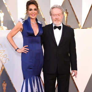 Ridley Scott et sa compagne Giannina Facio - Photocall de la 88ème cérémonie des Oscars au Dolby Theatre à Hollywood. Le 28 février 2016