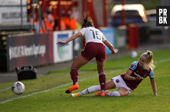 West Ham United's Alisha Lehmann (right) tackles Arsenal's Katie McCabe during the Barclays FA WSL match at The Chigwell Construction Stadium, London. ... West Ham United v Arsenal - Barclays FA Women's Super League - Chigwell Construction Stadium ... 12-09-2020 ... London ... UK ... Photo credit should read: Tess Derry/PA Wire. Unique Reference No. 55465053 ... Picture date: Saturday September 12, 2020. See PA story SOCCER West Ham Women. Photo credit should read: Tess Derry/PA Wire. EDITORIAL USE ONLY No use with unauthorised audio, video, data, fixture lists, club/league logos or \"live\" services. Online in-match use limited to 120 images, no video emulation. No use in betting, games or single club/league/player publications. 