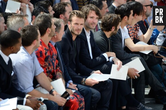 David Beckham très concentré pendant le défilé Louis Vuitton de la Fashion Week 2013