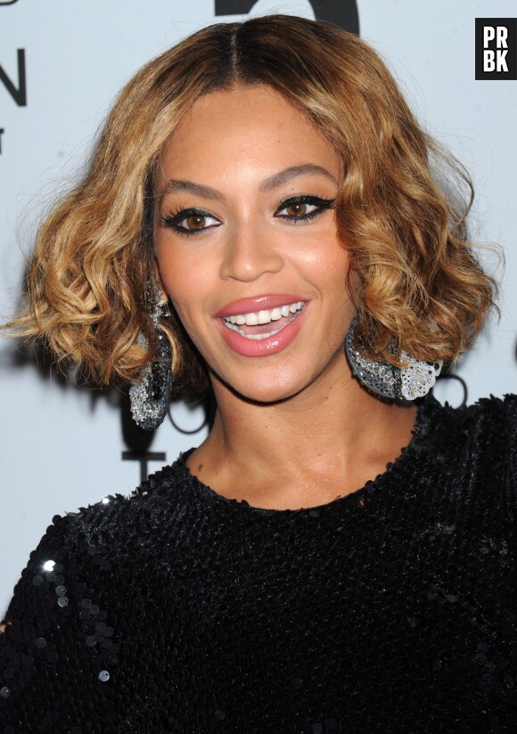Beyoncé souriante à l'inauguration d'une nouvelle boutique Topshop à New York, le 4 novembre 2014